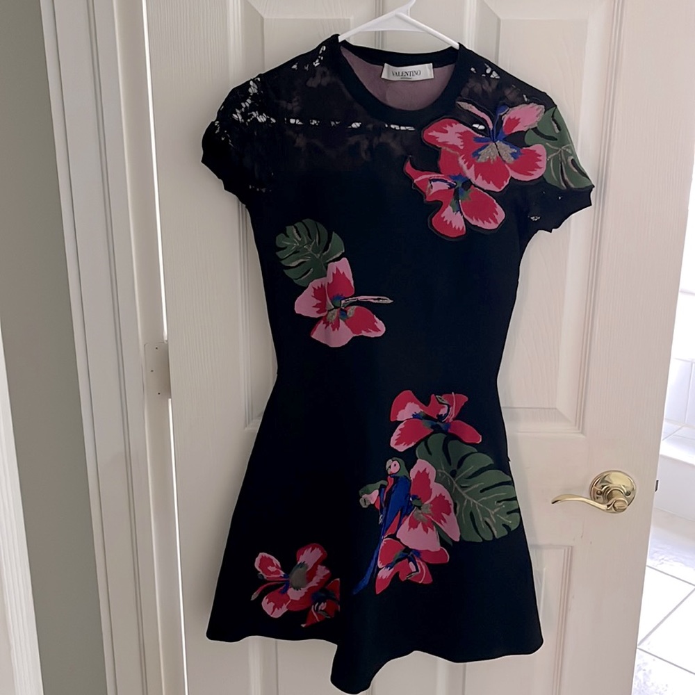 This is a beautiful black Valentino spa dress with pink butterflies.